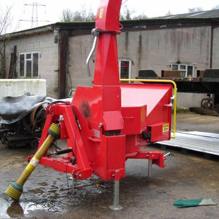 A Red Linkage Mounted Chipper 