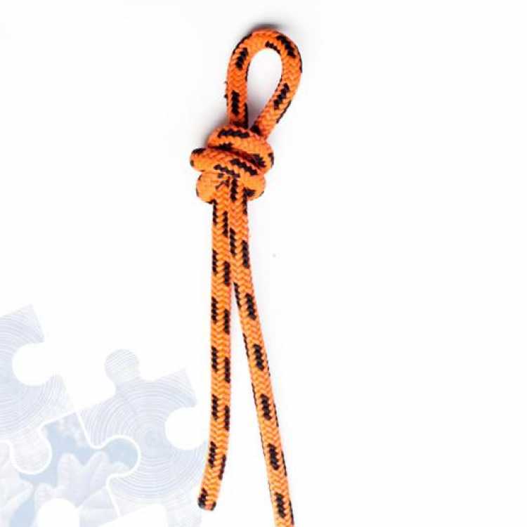 Orange rope showing third step of creating a Fishermans knot