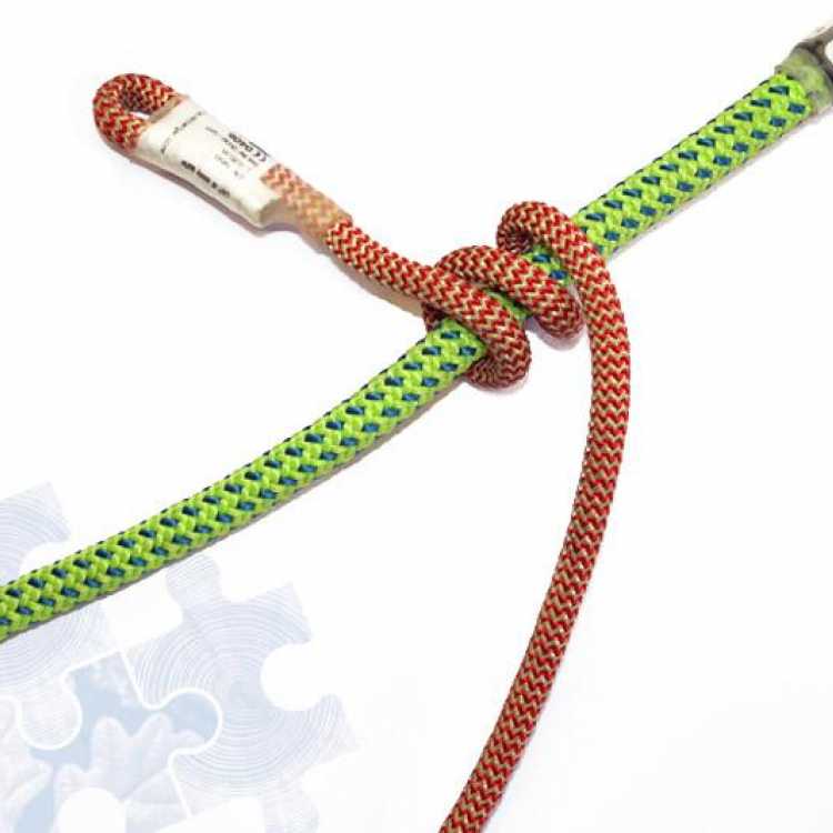 Green and red rope showing third step of creating a knot