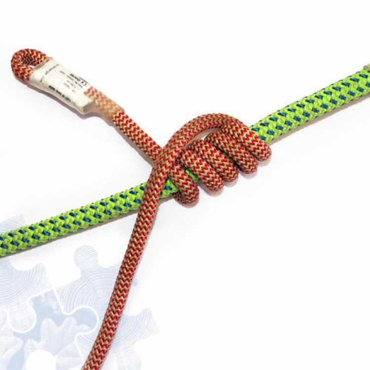Green and red rope showing fifth step of creating a knot