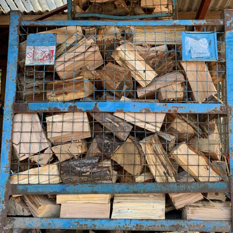 firewood stored in crates to maximise drying