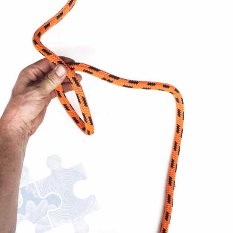 Second step on how to tie a Munter Hitch Knot